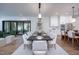 Open concept dining room with seating for eight and views of the kitchen and backyard at 1000 Marilyn Dr, Raleigh, NC 27607