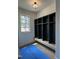 Entryway featuring a built in bench and black storage shelves at 1000 Marilyn Dr, Raleigh, NC 27607