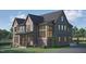 New construction home boasts a brick and siding exterior with a covered porch and manicured lawn at 1000 Marilyn Dr, Raleigh, NC 27607