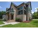 Exterior showcasing brick and siding, black-trimmed windows, and a meticulously landscaped lawn at 1000 Marilyn Dr, Raleigh, NC 27607