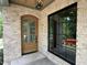 The front entrance features a brick exterior and a wood door with glass panes at 1000 Marilyn Dr, Raleigh, NC 27607