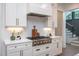 Bright kitchen features white cabinets, stainless steel appliances, and a stylish backsplash at 1000 Marilyn Dr, Raleigh, NC 27607