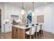 Open kitchen with central island, pendant lighting, and modern finishes at 1000 Marilyn Dr, Raleigh, NC 27607