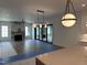 Bright living room features a fireplace with a marble surround and sliding glass doors to outdoor patio at 1000 Marilyn Dr, Raleigh, NC 27607