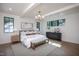 Bright main bedroom with wood floors, white walls, and beam ceilings at 1000 Marilyn Dr, Raleigh, NC 27607