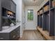 Mudroom includes built-in storage cubbies, bench seating, and bright natural light at 1000 Marilyn Dr, Raleigh, NC 27607
