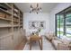 Well-lit office featuring custom built-ins, a large window, and modern decor for a comfortable workspace at 1000 Marilyn Dr, Raleigh, NC 27607