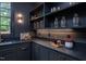 The kitchen features built-in shelving, countertops, and bar lighting at 1000 Marilyn Dr, Raleigh, NC 27607