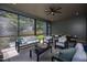 Covered patio offering serene backyard views, plus outdoor seating and dining area at 1000 Marilyn Dr, Raleigh, NC 27607