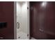 Modern shower with glass door, white tile, and brass hardware at 1000 Marilyn Dr, Raleigh, NC 27607