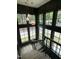 Elegant stairway with large windows and modern pendant lighting at 1000 Marilyn Dr, Raleigh, NC 27607