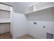 Bright utility room featuring washer/dryer hookups and built in shelving for extra storage at 1000 Marilyn Dr, Raleigh, NC 27607