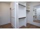 Spacious walk-in closet with custom shelving and a full-length mirror, providing ample storage at 1000 Marilyn Dr, Raleigh, NC 27607