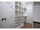 Well-organized walk-in closet featuring custom shelving and ample storage with natural light at 1000 Marilyn Dr, Raleigh, NC 27607