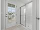 Bathroom with a walk-in shower and access to a private balcony at 9228 Kitchin Farms Way # 412, Wake Forest, NC 27587
