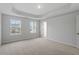 Well-lit bedroom featuring carpet flooring and neutral-toned walls at 9228 Kitchin Farms Way # 412, Wake Forest, NC 27587