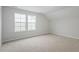 Bright bedroom with carpet flooring and two large windows at 9228 Kitchin Farms Way # 412, Wake Forest, NC 27587