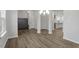 Open concept dining area with wood-look floors and built-in bench at 9228 Kitchin Farms Way # 412, Wake Forest, NC 27587