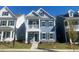 Two-story home with gray siding and a balcony at 9228 Kitchin Farms Way # 412, Wake Forest, NC 27587