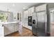 Kitchen features stainless steel appliances and white cabinets at 11603 Broadfield Ct, Raleigh, NC 27617