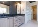 A modern bathroom featuring double vanities, black hardware, and sleek design at 155 Gaines Trl, Pittsboro, NC 27312