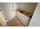 Bathroom featuring a white vanity with modern chrome pulls near an open door at 155 Gaines Trl, Pittsboro, NC 27312