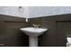 Elegant half-bathroom with pedestal sink and patterned wallpaper at 155 Gaines Trl, Pittsboro, NC 27312