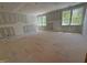 Spacious bedroom features natural light with large windows overlooking the outdoors at 155 Gaines Trl, Pittsboro, NC 27312