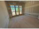 Unfinished bedroom showcasing large windows and natural light at 155 Gaines Trl, Pittsboro, NC 27312