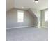 Well-lit bedroom features a window and neutral carpeting, creating a calming and inviting atmosphere at 155 Gaines Trl, Pittsboro, NC 27312