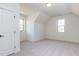 Spacious bedroom with high ceilings, two windows, and neutral carpet creating a bright, airy feel at 155 Gaines Trl, Pittsboro, NC 27312