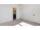 Bright bedroom features neutral carpet and fresh, white walls with ensuite bathroom access at 155 Gaines Trl, Pittsboro, NC 27312