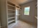 Walk-in closet showcasing custom shelving and storage solutions, optimized for organization and convenience at 155 Gaines Trl, Pittsboro, NC 27312