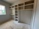 Walk-in closet featuring custom shelving and storage, providing an organized and functional space at 155 Gaines Trl, Pittsboro, NC 27312