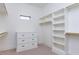 Organized closet features custom shelving and drawers, offering ample storage space and convenience at 155 Gaines Trl, Pittsboro, NC 27312