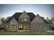 Charming two-story home with a mix of siding and stone accents and a covered front porch at 155 Gaines Trl, Pittsboro, NC 27312