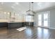 A spacious eat-in kitchen showcases an island, stainless appliances, and double doors that let in ample natural light at 155 Gaines Trl, Pittsboro, NC 27312