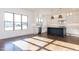 Well-lit kitchen with a dark island, stainless steel appliances, a view of the backyard, and great counter space at 155 Gaines Trl, Pittsboro, NC 27312