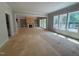 Bright living room with built-in shelves, fireplace, and sliding doors to the outdoors at 155 Gaines Trl, Pittsboro, NC 27312