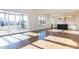 Bright living room with sliding glass door, hardwood floors, and open access to modern kitchen at 155 Gaines Trl, Pittsboro, NC 27312