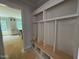 Mudroom complete with cubbies and a bench perfect for storage and transition from outdoors at 155 Gaines Trl, Pittsboro, NC 27312