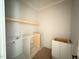Pantry features white cabinets and shelving awaiting installation for seamless organization at 155 Gaines Trl, Pittsboro, NC 27312