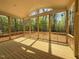 Spacious screened-in porch with wood floors and ceiling, perfect for enjoying the outdoors at 155 Gaines Trl, Pittsboro, NC 27312