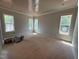 Spacious, unfinished room with ample natural light from multiple windows and a decorative ceiling at 155 Gaines Trl, Pittsboro, NC 27312