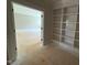 Room with custom built-in shelving and an open doorway, blending style and functionality at 155 Gaines Trl, Pittsboro, NC 27312