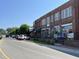Street view showing a line of brick commercial buildings, showcasing local businesses and street parking at 155 Gaines Trl, Pittsboro, NC 27312
