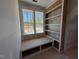 Window nook features a built-in bookcase and seat with storage overlooking a lush landscape at 155 Gaines Trl, Pittsboro, NC 27312