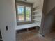 Window seat with built in bookshelves in a room with natural light at 155 Gaines Trl, Pittsboro, NC 27312