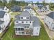 Aerial view of a home's rear, highlighting a screened porch and deck at 2518 Silas Peak Ln, Apex, NC 27523