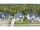 Aerial perspective of a two-story house with a nicely landscaped yard at 2518 Silas Peak Ln, Apex, NC 27523